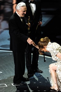 Actress Melissa Leo accepts award from Kirk Douglas during the 83rd Annual Academy Awards