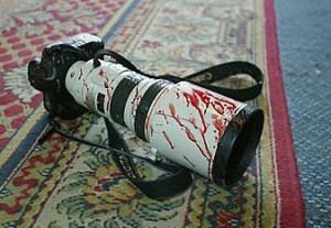 Journalists Camera Covered in Blood