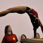 Jaenal Peterson competing on vault during a gymnastics competiton at Wilson H.S. (Photographed by Arun Nevader) 
