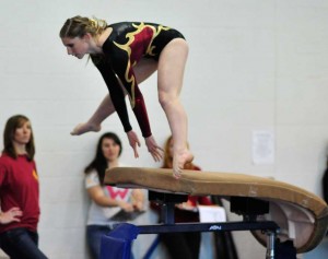 Wilson H.S. Girls Gymnastic Student Bridget Starr Competing in Vault (Photo by Arun Nevader)