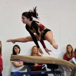 Renia Meyers competing on vault during a gymnastics competiton at Wilson H.S. (Photographed by Arun Nevader) 