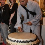 Drummer entertaining guests before the runway show for Japan Releif Fundraiser at EM&CO