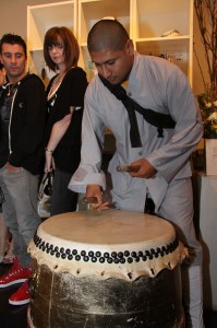 Drummer entertaining guests before the runway show for Japan Releif Fundraiser at EM&CO