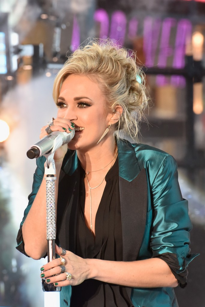 NEW YORK, NY - DECEMBER 31: Carrie Underwood performs during New Year's Eve celebrations at Times Square on December 31, 2015 in New York City. (Photo by Eugene Gologursky/Getty Images for TOSHIBA CORPORATION) *** Local Caption *** Carrie Underwood