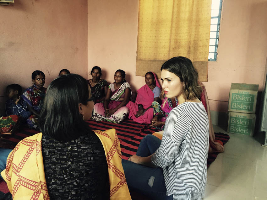 Actress, singer/songwriter and PSI Global Ambassador Mandy Moore meets with a group of women in Bihar, India, who took out a loan together to build a toilet for their community. Before the toilet, many women had been shamed and verbally harassed when relieving themselves in nearby fields.