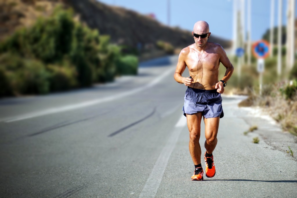 man-jogging-on-side-of-road