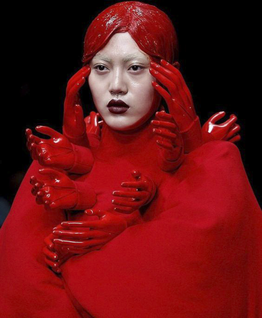 Model in Blood Red with Multiple Hands